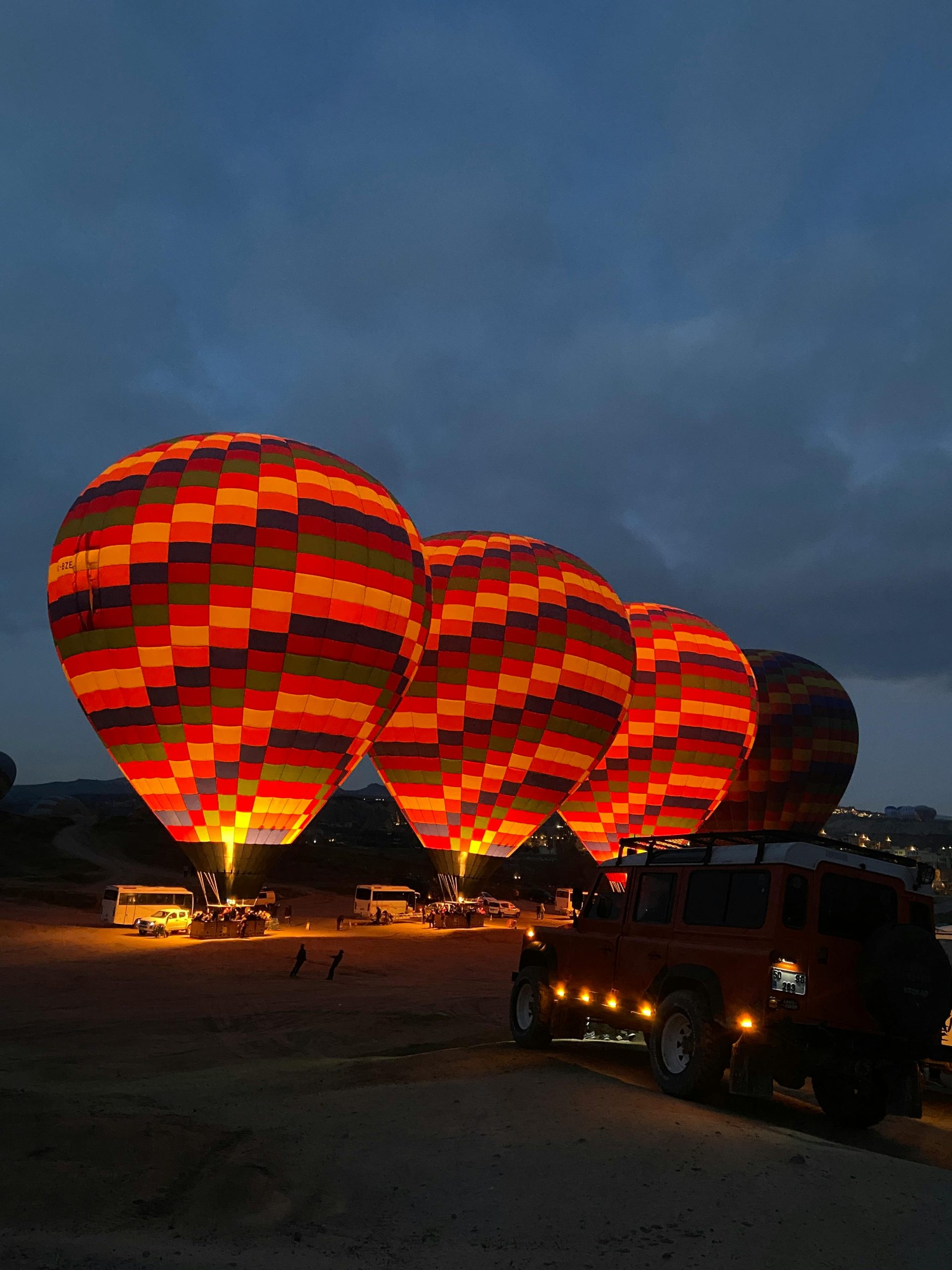 top places to visit in Kenya — Masai Mara game drive at dawn with hot air balloon in background